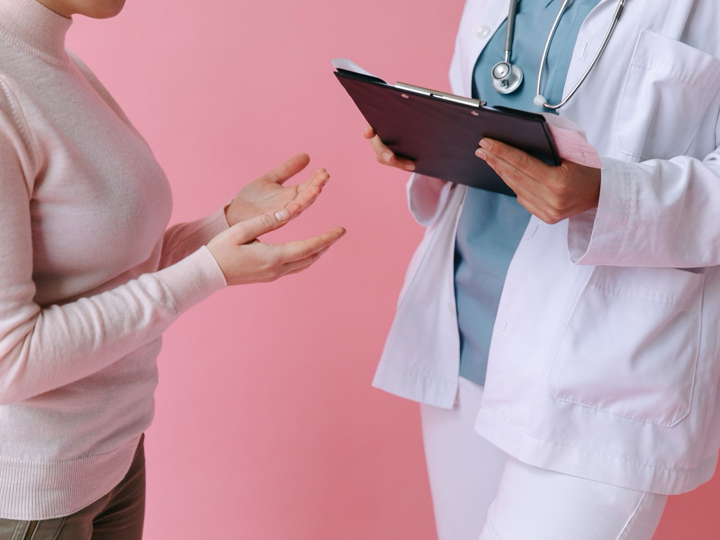 Clinician consulting with a patient about illness symptoms